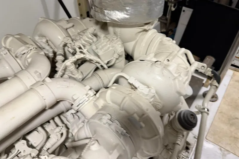 Slide: The Image of Engine room of a 2017 Azimut Fly 72 yacht, showcasing complex machinery and piping. - 59