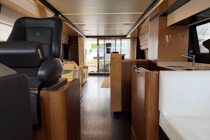 Slide: The Image of Luxurious interior of a 2017 Azimut Fly 72 yacht, featuring elegant wood finishes and modern design. - 6