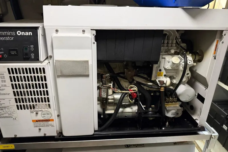 Slide: The Image of Cummins Onan generator inside a 2017 Azimut Fly 72 yacht, showcasing engine components. - 60