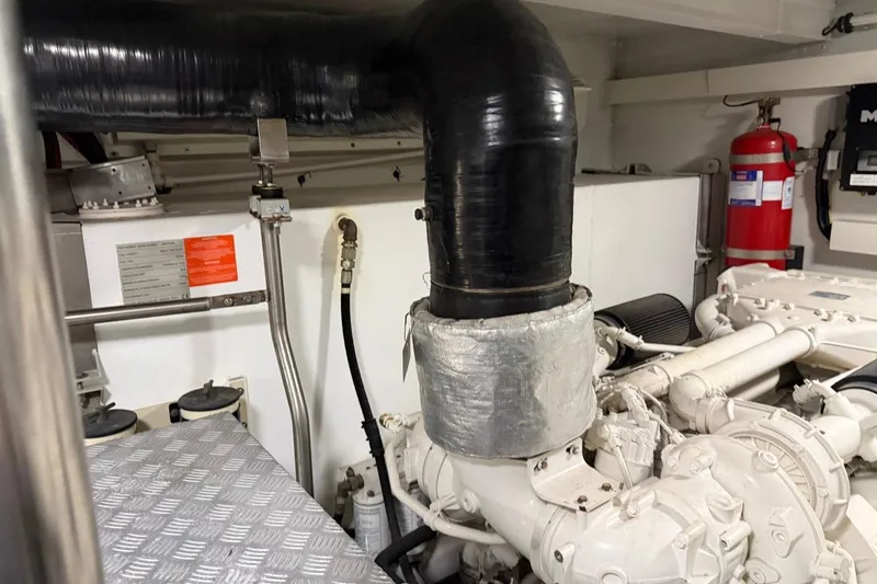 Slide: The Image of Engine room of 2017 Azimut Fly 72 yacht, featuring machinery and safety equipment. - 66