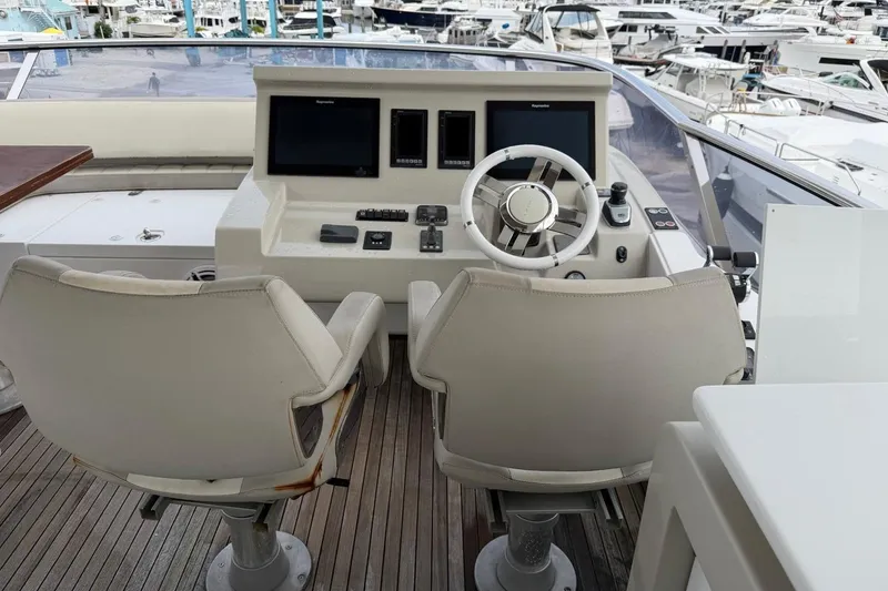 Slide: The Image of Cockpit of 2017 Azimut Fly 72 yacht with dual seats and navigation controls. - 7