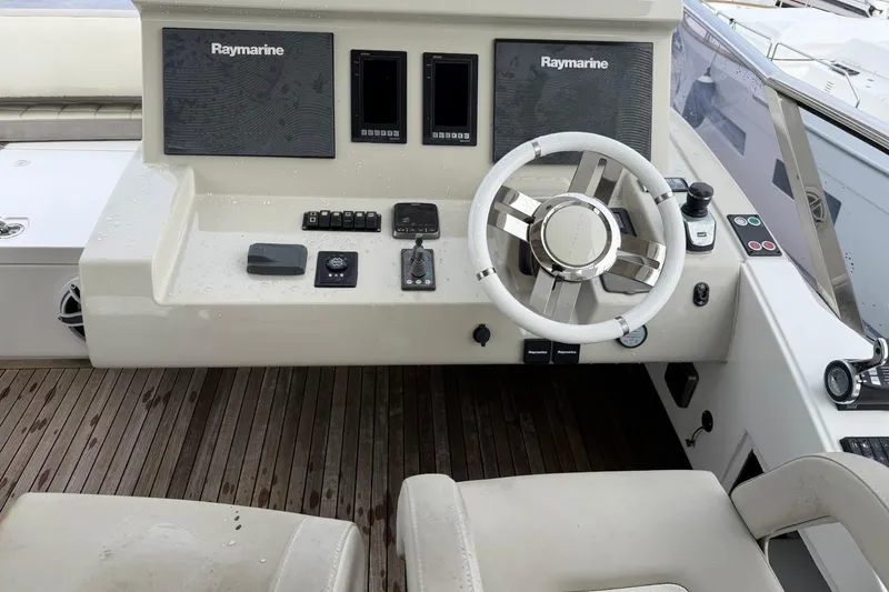 Slide: The Image of Cockpit of 2017 Azimut Fly 72 yacht with Raymarine navigation system and steering wheel. - 9