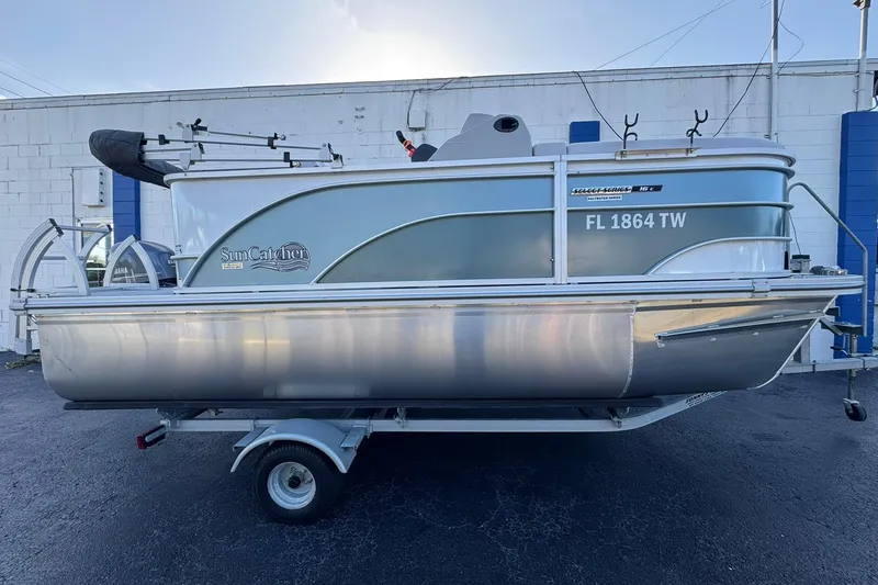 The Image of 2024 SunCatcher Select 16C pontoon boat on trailer, side view. - 1