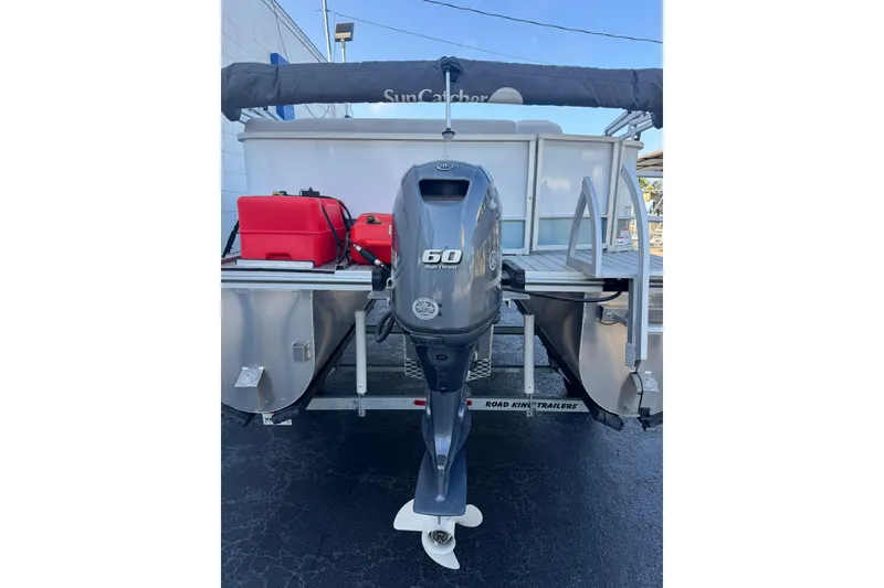 Slide: The Image of 2024 SunCatcher Select 16C pontoon boat with 60 HP outboard motor. - 3