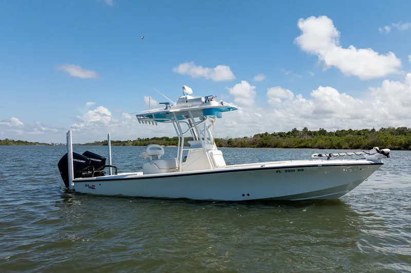 The Image of 2018 SeaVee 270Z boat on calm water under a clear blue sky. - 0