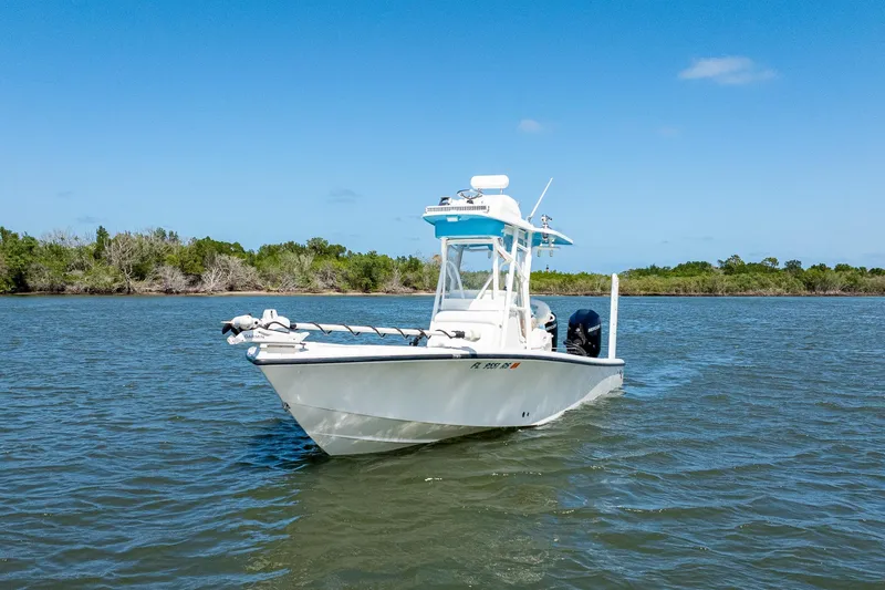 Slide: The Image of 2018 SeaVee 270Z boat on calm water with clear blue sky background. - 1