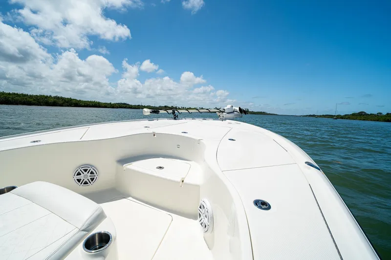 Slide: The Image of 2018 SeaVee 270Z boat on calm water under a clear blue sky. - 10