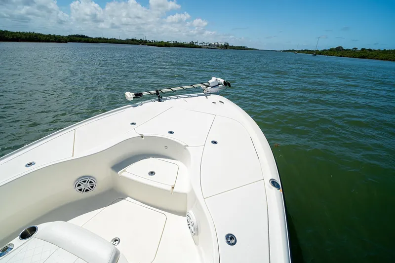 Slide: The Image of 2018 SeaVee 270Z boat on calm water under a clear blue sky. - 11