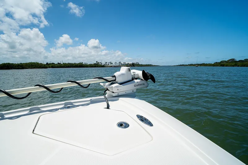 Slide: The Image of 2018 SeaVee 270Z boat with Garmin equipment on calm water under blue sky. - 13