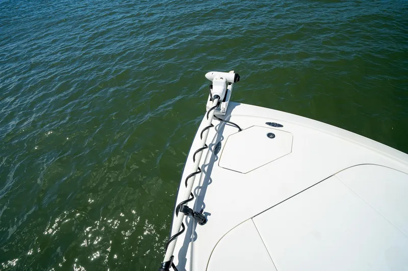 Slide: The Image of Bow of 2018 SeaVee 270Z boat with trolling motor on calm water. - 16