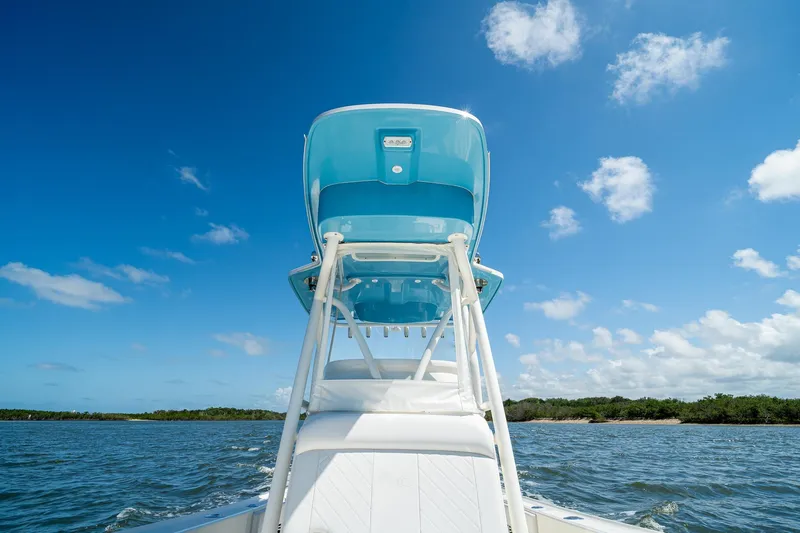 Slide: The Image of 2018 SeaVee 270Z boat on water under clear blue sky. - 18