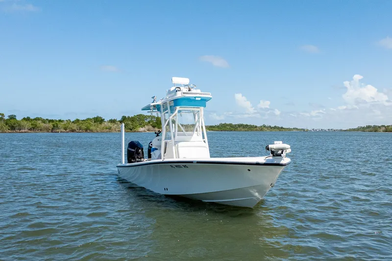 Slide: The Image of 2018 SeaVee 270Z boat on calm water under clear blue sky. - 2