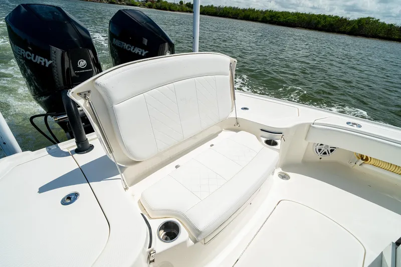 Slide: The Image of 2018 SeaVee 270Z boat with white seating and dual Mercury engines on water. - 22