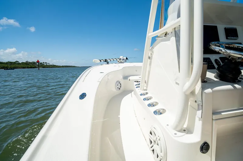 Slide: The Image of 2018 SeaVee 270Z boat on calm water under clear blue sky. - 23