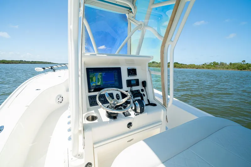 Slide: The Image of 2018 SeaVee 270Z boat dashboard with navigation system on calm water. - 27