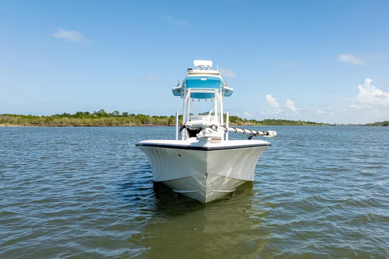 Slide: The Image of 2018 SeaVee 270Z boat on calm water under clear blue sky. - 3