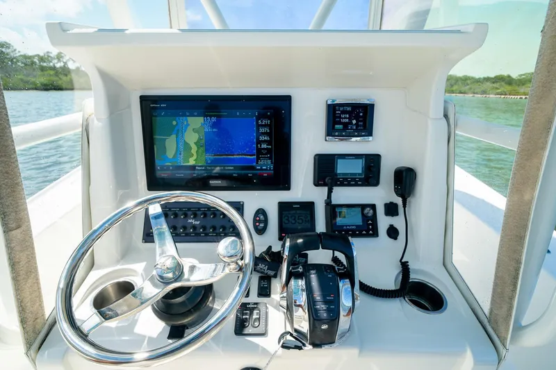Slide: The Image of Helm of 2018 SeaVee 270Z boat with advanced navigation and control systems. - 31