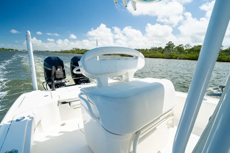 Slide: The Image of 2018 SeaVee 270Z boat with dual Mercury engines on a sunny day. - 32