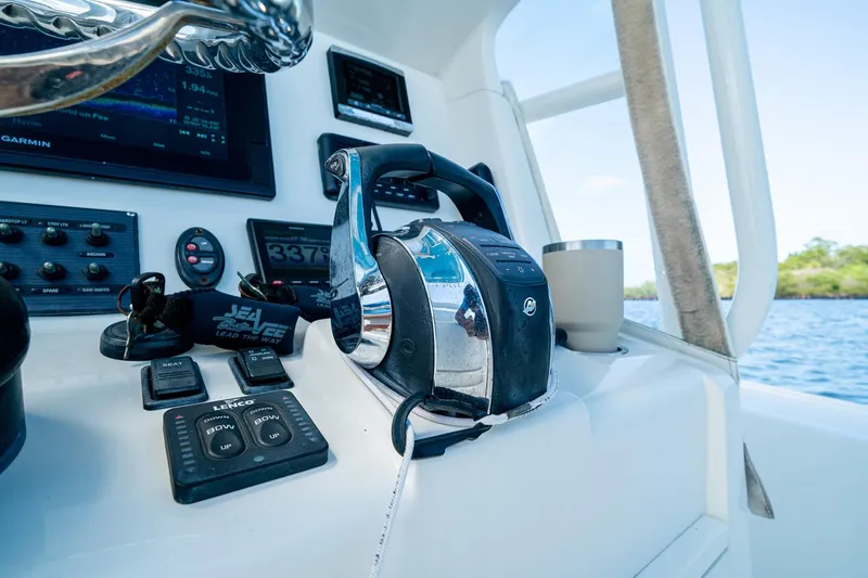 Slide: The Image of Control panel of a 2018 SeaVee 270Z boat with navigation equipment. - 38