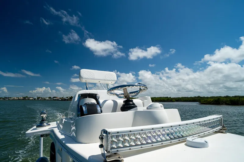 Slide: The Image of 2018 SeaVee 270Z boat on water under clear blue sky. - 46