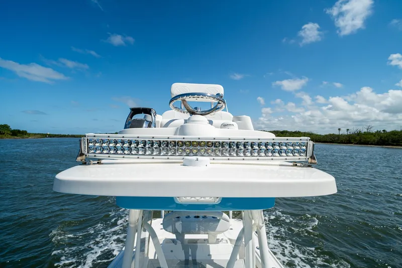 Slide: The Image of 2018 SeaVee 270Z boat with LED lights on water under blue sky. - 57