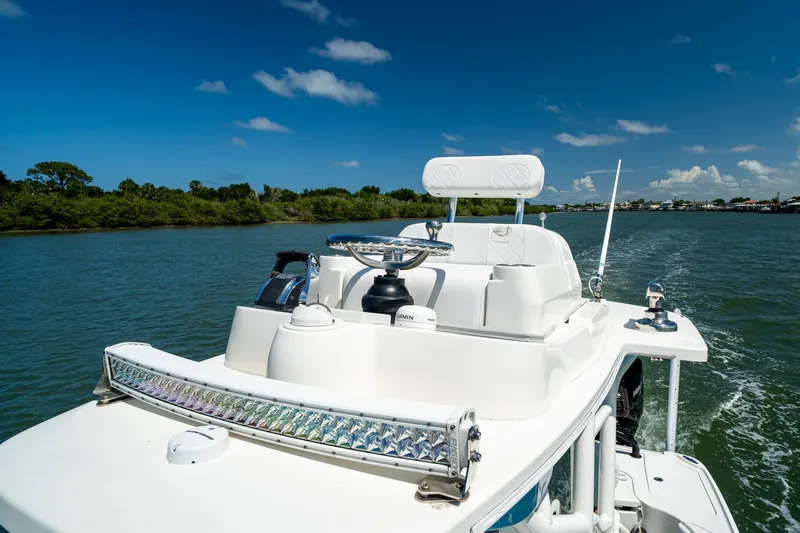 Slide: The Image of 2018 SeaVee 270Z boat cruising on a sunny day, featuring sleek design and advanced equipment. - 58