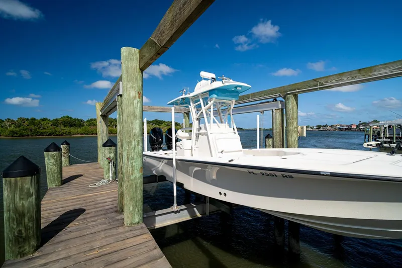 Slide: The Image of 2018 SeaVee 270Z boat docked on a sunny day by the water. - 62
