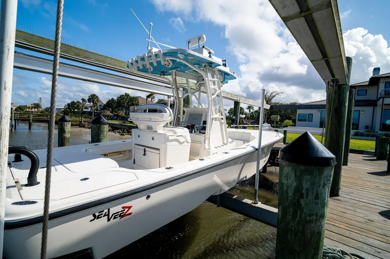 Slide: The Image of 2018 SeaVee 270Z boat docked, featuring sleek design and modern amenities. - 63