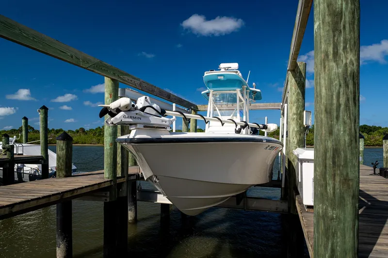 Slide: The Image of 2018 SeaVee 270Z boat docked, featuring Garmin equipment, under a clear blue sky. - 66