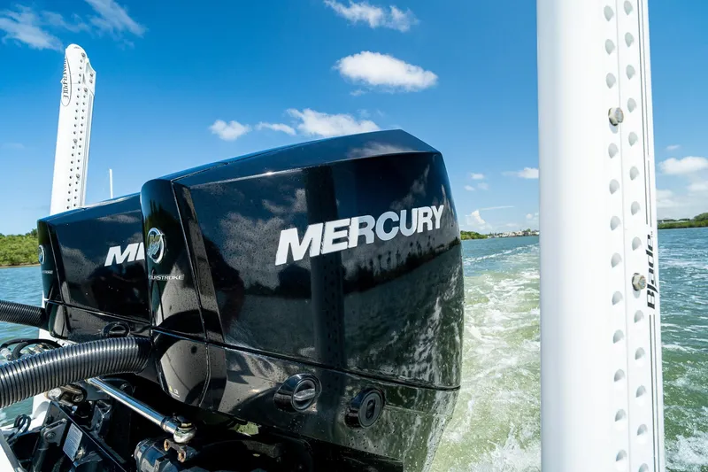 Slide: The Image of Twin Mercury outboard engines on a 2018 SeaVee 270Z boat, cruising on a sunny day. - 71