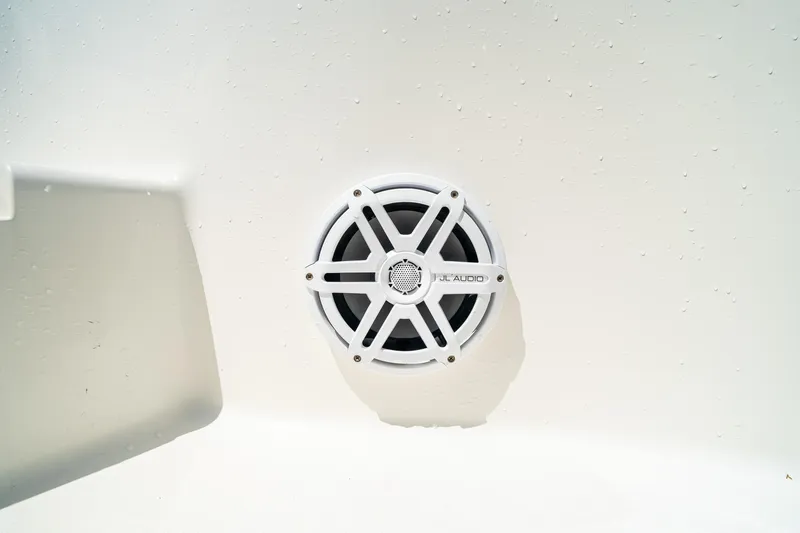 Slide: The Image of White JL Audio speaker on 2018 SeaVee 270Z boat surface. - 72