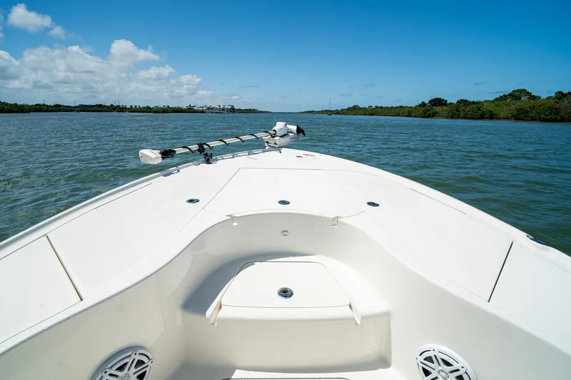 Slide: The Image of Bow view of 2018 SeaVee 270Z boat on a sunny day, cruising through calm waters. - 9