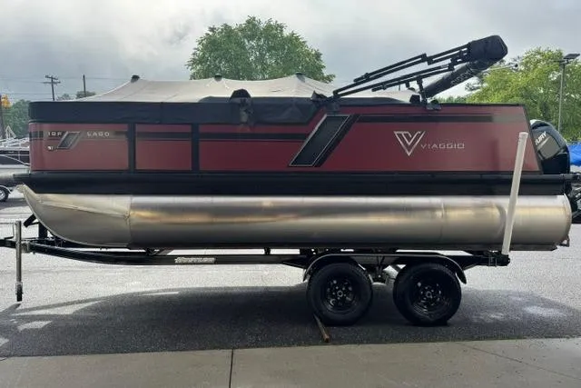 Slide: The Image of 2022 Viaggio Lago 18F pontoon boat on trailer, parked outdoors. - 3