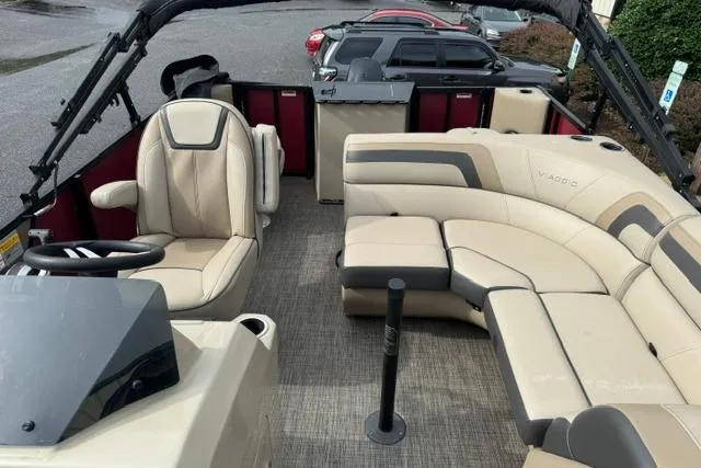 Slide: The Image of Interior of a 2022 Viaggio Lago 18F pontoon boat with beige seating. - 6