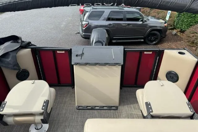 Slide: The Image of 2022 Viaggio Lago 18F boat interior with beige seating and red accents. - 7