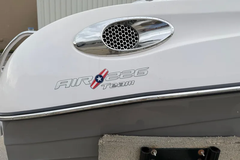 Slide: The Image of 2006 Nautique Super Air Nautique 220 boat with "Air 226 Team" logo detail. - 10