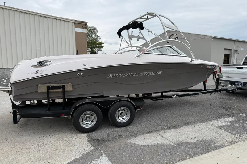 Slide: The Image of 2006 Nautique Super Air Nautique 220 boat on trailer, parked outdoors. - 11