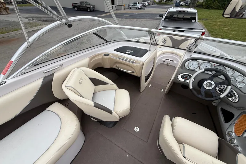 Slide: The Image of 2006 Nautique Super Air Nautique 220 boat interior with steering wheel and seating. - 7