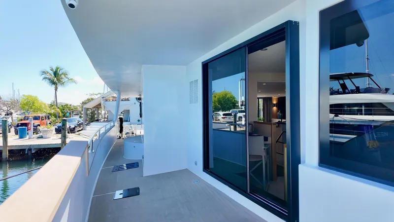 Slide: The Image of LEEN-TRIMARANS 72, 2024, modern yacht with spacious deck and glass windows. - 15