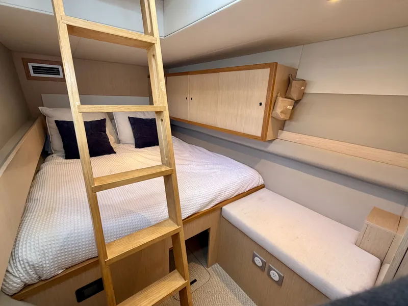 Slide: The Image of Interior of LEEN-TRIMARANS 72, 2024, featuring cozy bed and wooden ladder. - 33