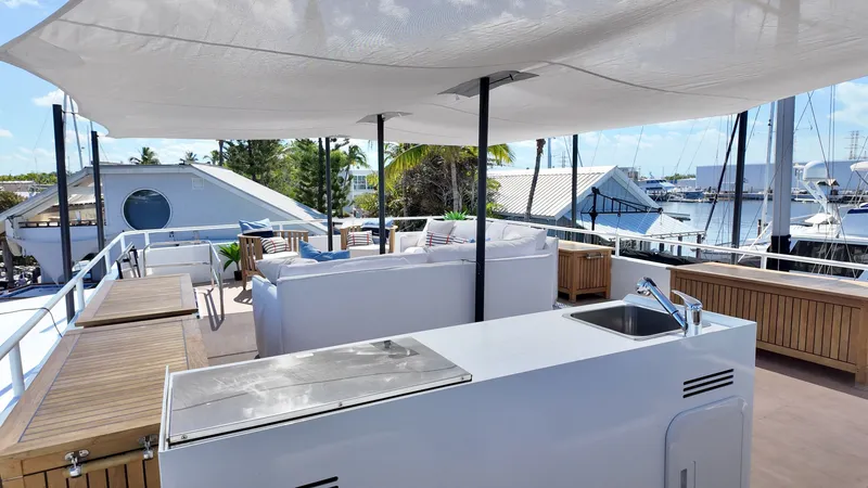 Slide: The Image of LEEN-TRIMARANS 72, 2024 model, luxurious deck with seating and kitchenette. - 4
