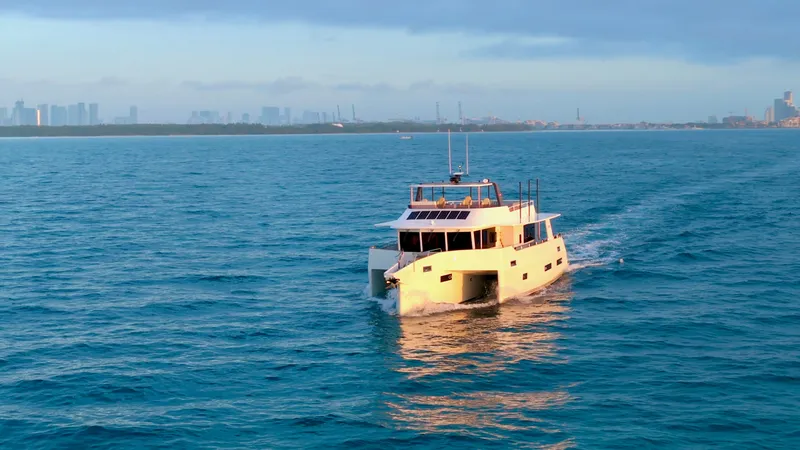 Slide: The Image of 2024 LEEN-TRIMARANS 72 cruising on open sea at sunset. - 42