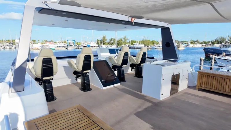 Slide: The Image of LEEN-TRIMARANS 72 Yacht 2024 with helm station and harbor view. - 8