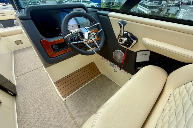 Slide: The Image of 2026 Chris-Craft Sportster 28 interior with steering wheel and control panel. - 7