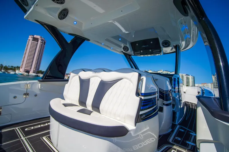 Slide: The Image of 2024 MTI V42 luxury boat interior with modern seating and sleek design. - 12