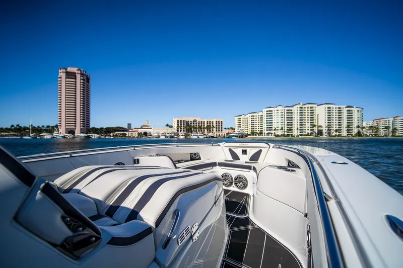 Slide: The Image of 2024 MTI V42 luxury boat interior with city skyline and waterfront view. - 14