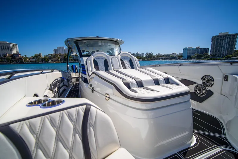 Slide: The Image of Luxurious 2024 MTI V42 boat interior with plush seating and waterfront view. - 16