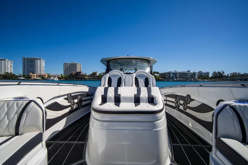 Slide: The Image of Luxurious 2024 MTI V42 yacht interior with plush seating and waterfront skyline view. - 17