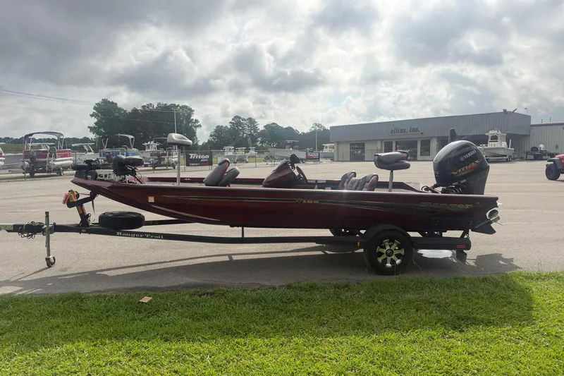 The Image of 2019 Ranger RT188 boat on trailer, parked outdoors near dealership. - 1