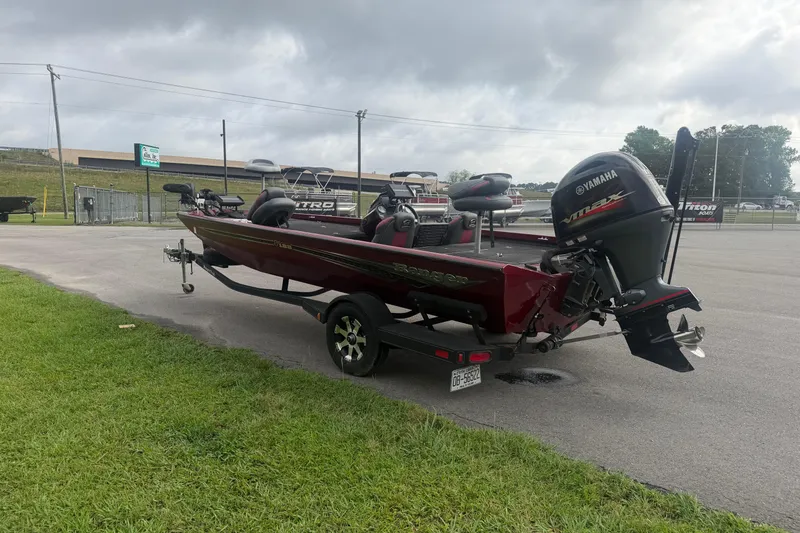 Slide: The Image of 2019 Ranger RT188 boat with Yamaha engine parked outdoors on a cloudy day. - 3